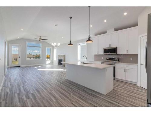 20 Country Meadows Cove, Diamond Valley, AB - Indoor Photo Showing Kitchen With Upgraded Kitchen