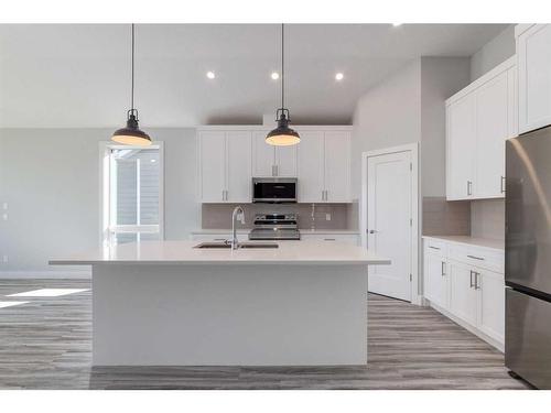 20 Country Meadows Cove, Diamond Valley, AB - Indoor Photo Showing Kitchen