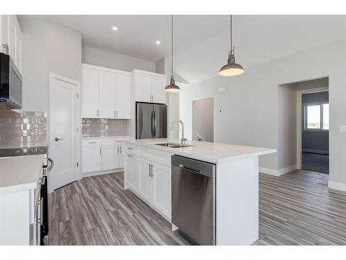 20 Country Meadows Cove, Diamond Valley, AB - Indoor Photo Showing Kitchen With Double Sink With Upgraded Kitchen