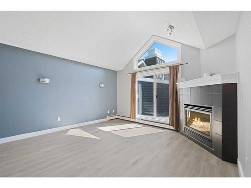 401-10 Sierra Morena Mews Sw, Calgary, AB - Indoor With Fireplace