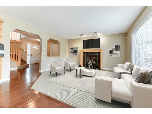 322 Cranfield Gardens Se, Calgary, AB - Indoor Photo Showing Living Room With Fireplace