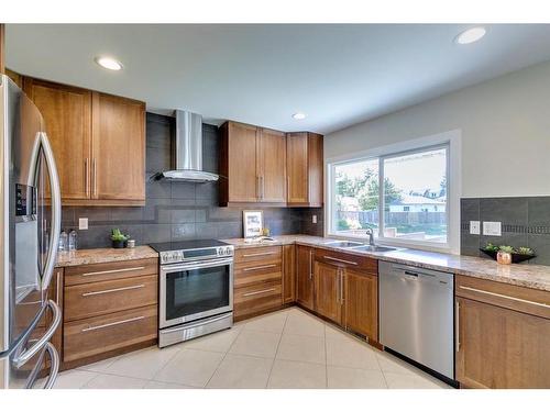 307 Simons Road Nw, Calgary, AB - Indoor Photo Showing Kitchen With Stainless Steel Kitchen With Double Sink