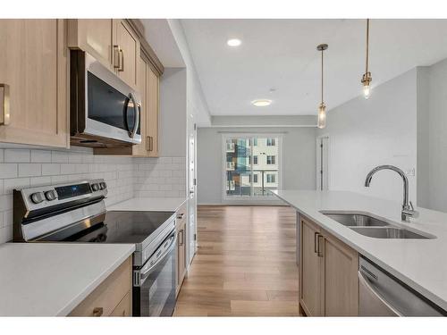 311-80 Carrington Plaza Nw, Calgary, AB - Indoor Photo Showing Kitchen With Stainless Steel Kitchen With Double Sink With Upgraded Kitchen