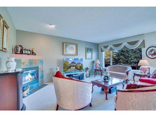 130 Valley Stream Circle Nw, Calgary, AB - Indoor Photo Showing Living Room With Fireplace