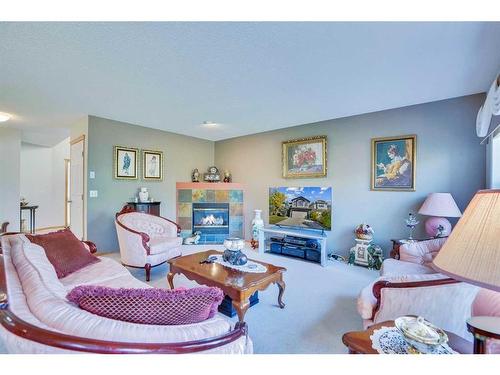 130 Valley Stream Circle Nw, Calgary, AB - Indoor Photo Showing Living Room With Fireplace