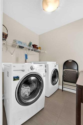 164 Rainbow Falls Heath, Chestermere, AB - Indoor Photo Showing Laundry Room