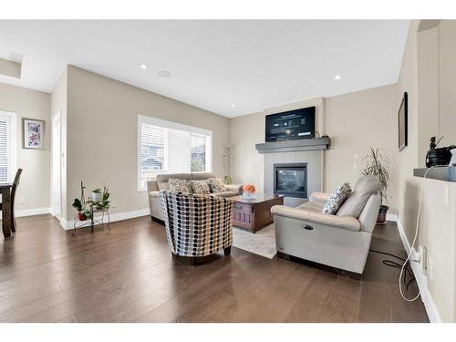 164 Rainbow Falls Heath, Chestermere, AB - Indoor Photo Showing Living Room With Fireplace