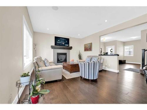 164 Rainbow Falls Heath, Chestermere, AB - Indoor Photo Showing Living Room With Fireplace