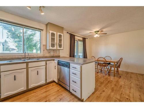 4 Edgedale Court Nw, Calgary, AB - Indoor Photo Showing Kitchen With Double Sink