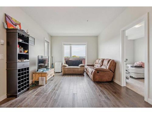 2328-604 East Lake Boulevard Ne, Airdrie, AB - Indoor Photo Showing Living Room