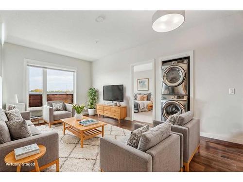 2328-604 East Lake Boulevard Ne, Airdrie, AB - Indoor Photo Showing Living Room