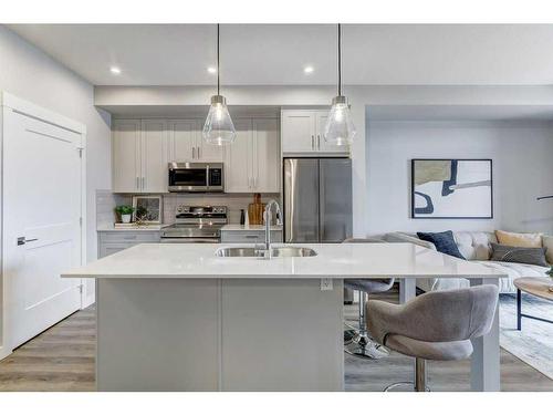 2310-55 Lucas Way Nw, Calgary, AB - Indoor Photo Showing Kitchen With Stainless Steel Kitchen With Double Sink With Upgraded Kitchen