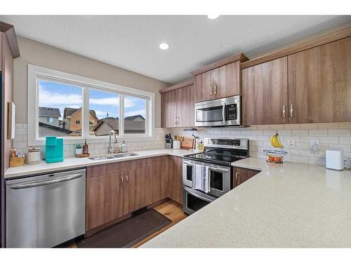 189 Legacy Crescent Se, Calgary, AB - Indoor Photo Showing Kitchen With Stainless Steel Kitchen With Double Sink