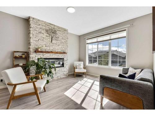 20 Wolf Crescent, Okotoks, AB - Indoor Photo Showing Living Room With Fireplace