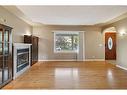 413 26 Avenue Nw, Calgary, AB  - Indoor Photo Showing Living Room With Fireplace 