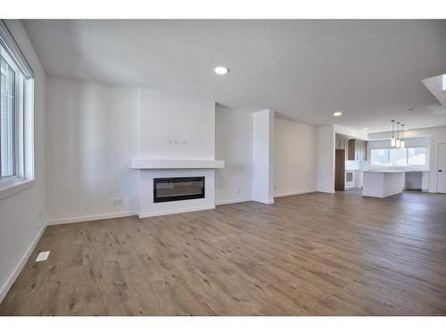 131 Legacy Reach Court Se, Calgary, AB - Indoor Photo Showing Living Room With Fireplace