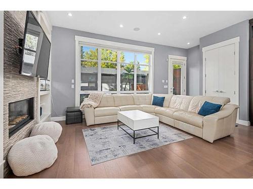 3240 Kerrydale Road Sw, Calgary, AB - Indoor Photo Showing Living Room With Fireplace