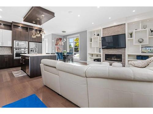 3240 Kerrydale Road Sw, Calgary, AB - Indoor Photo Showing Living Room With Fireplace