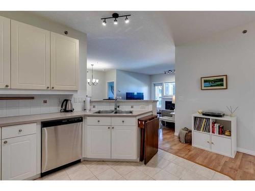 311-4507 45 Street Sw, Calgary, AB - Indoor Photo Showing Kitchen With Double Sink