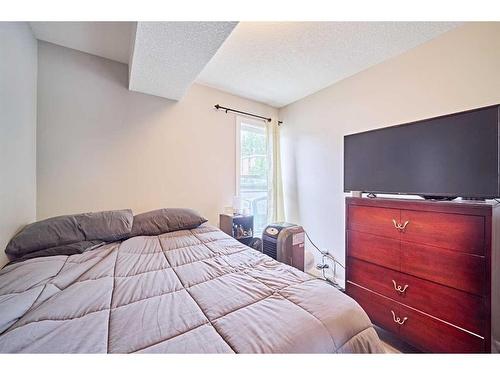 306-1820 9, Calgary, AB - Indoor Photo Showing Bedroom