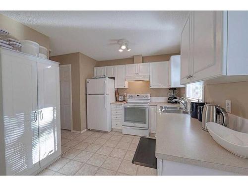 133 Citadel Pointe Nw, Calgary, AB - Indoor Photo Showing Kitchen With Double Sink