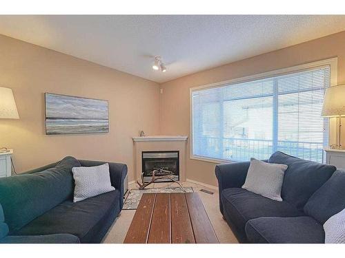 133 Citadel Pointe Nw, Calgary, AB - Indoor Photo Showing Living Room With Fireplace