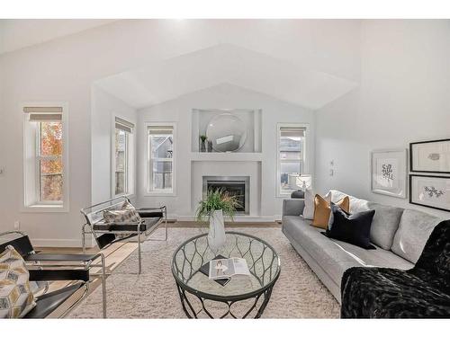 23 Royal Ridge Manor Nw, Calgary, AB - Indoor Photo Showing Living Room With Fireplace