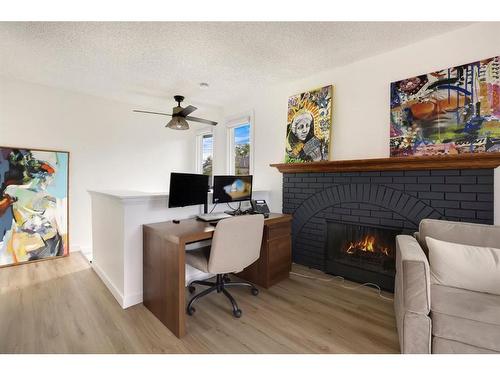 104-205 5 Avenue Ne, Calgary, AB - Indoor With Fireplace