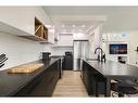 104-205 5 Avenue Ne, Calgary, AB  - Indoor Photo Showing Kitchen With Upgraded Kitchen 