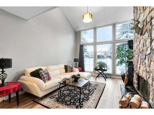 57-28 Berwick Crescent Nw, Calgary, AB - Indoor Photo Showing Living Room With Fireplace