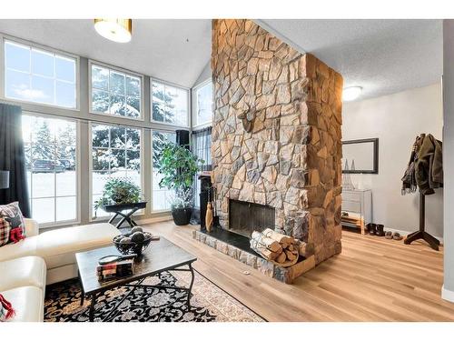 57-28 Berwick Crescent Nw, Calgary, AB - Indoor Photo Showing Living Room With Fireplace