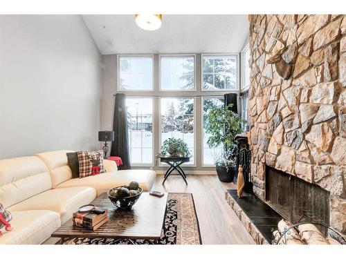 57-28 Berwick Crescent Nw, Calgary, AB - Indoor Photo Showing Living Room With Fireplace