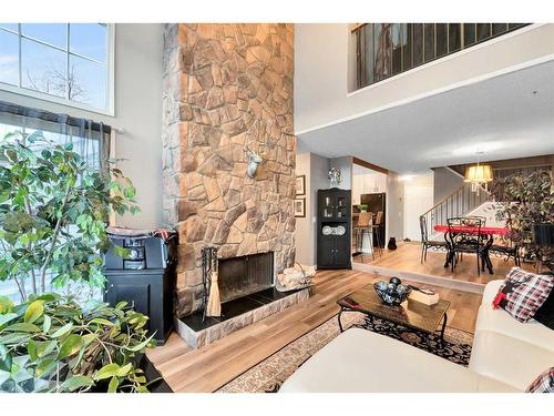 57-28 Berwick Crescent Nw, Calgary, AB - Indoor Photo Showing Living Room With Fireplace