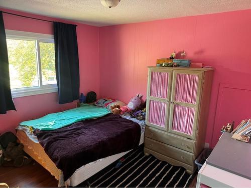 419 2Nd Street Se, High River, AB - Indoor Photo Showing Bedroom