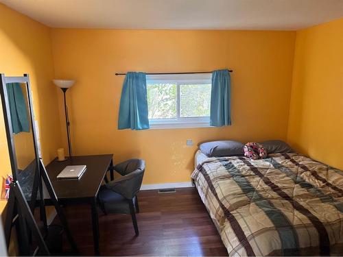 419 2Nd Street Se, High River, AB - Indoor Photo Showing Bedroom