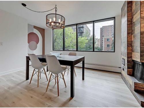 202-1020 14 Avenue Sw, Calgary, AB - Indoor Photo Showing Dining Room With Fireplace