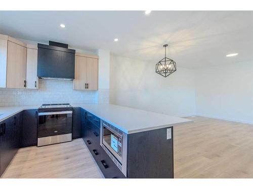 216 Corner Glen Avenue Ne, Calgary, AB - Indoor Photo Showing Kitchen With Double Sink With Upgraded Kitchen