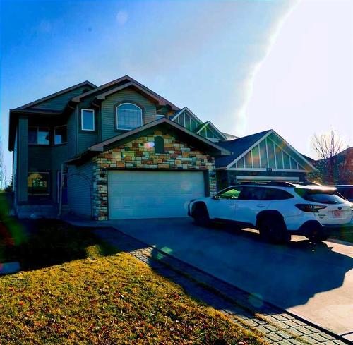 321 Crystal Shores View, Okotoks, AB - Outdoor With Facade