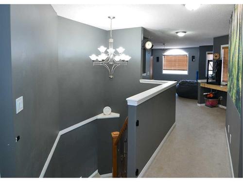 321 Crystal Shores View, Okotoks, AB - Indoor Photo Showing Other Room