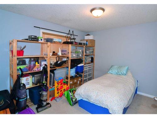 321 Crystal Shores View, Okotoks, AB - Indoor Photo Showing Bedroom