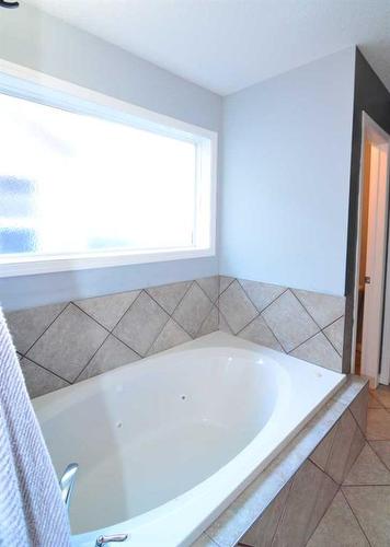 321 Crystal Shores View, Okotoks, AB - Indoor Photo Showing Bathroom