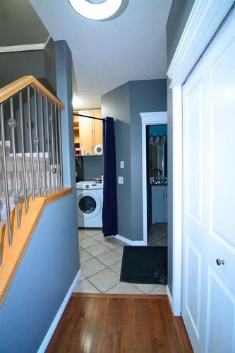 321 Crystal Shores View, Okotoks, AB - Indoor Photo Showing Laundry Room