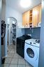 321 Crystal Shores View, Okotoks, AB  - Indoor Photo Showing Laundry Room 