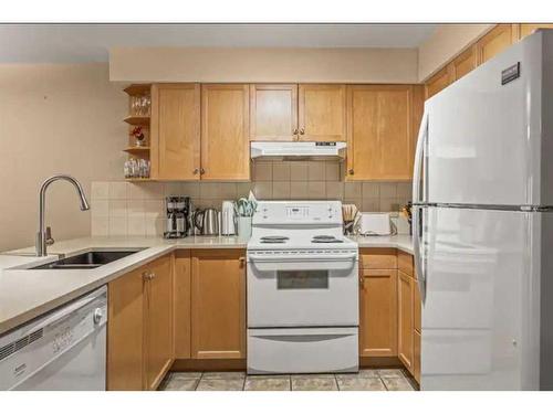 202-743 Railway Avenue, Canmore, AB - Indoor Photo Showing Kitchen With Double Sink