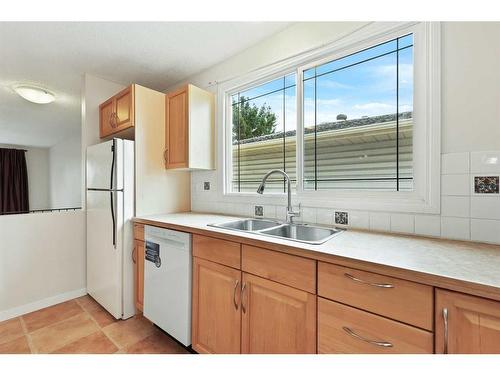 5A Radcliffe Crescent Se, Calgary, AB - Indoor Photo Showing Kitchen With Double Sink