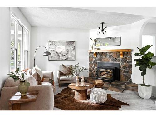 608 1 Avenue Nw, Calgary, AB - Indoor Photo Showing Living Room With Fireplace