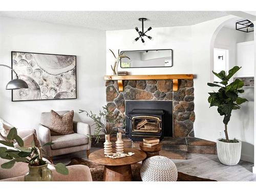 608 1 Avenue Nw, Calgary, AB - Indoor Photo Showing Living Room With Fireplace