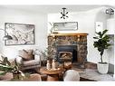 608 1 Avenue Nw, Calgary, AB  - Indoor Photo Showing Living Room With Fireplace 