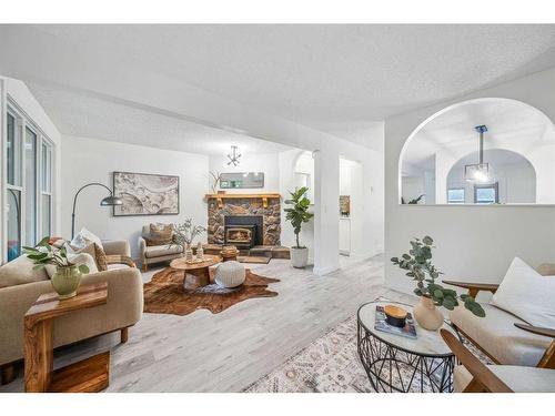 608 1 Avenue Nw, Calgary, AB - Indoor Photo Showing Living Room With Fireplace