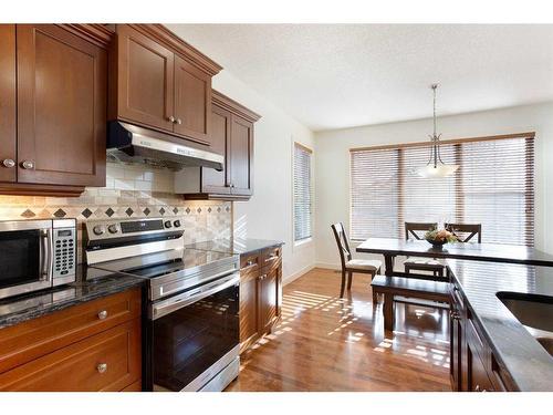 74 Elgin Park Road Se, Calgary, AB - Indoor Photo Showing Living Room With Fireplace